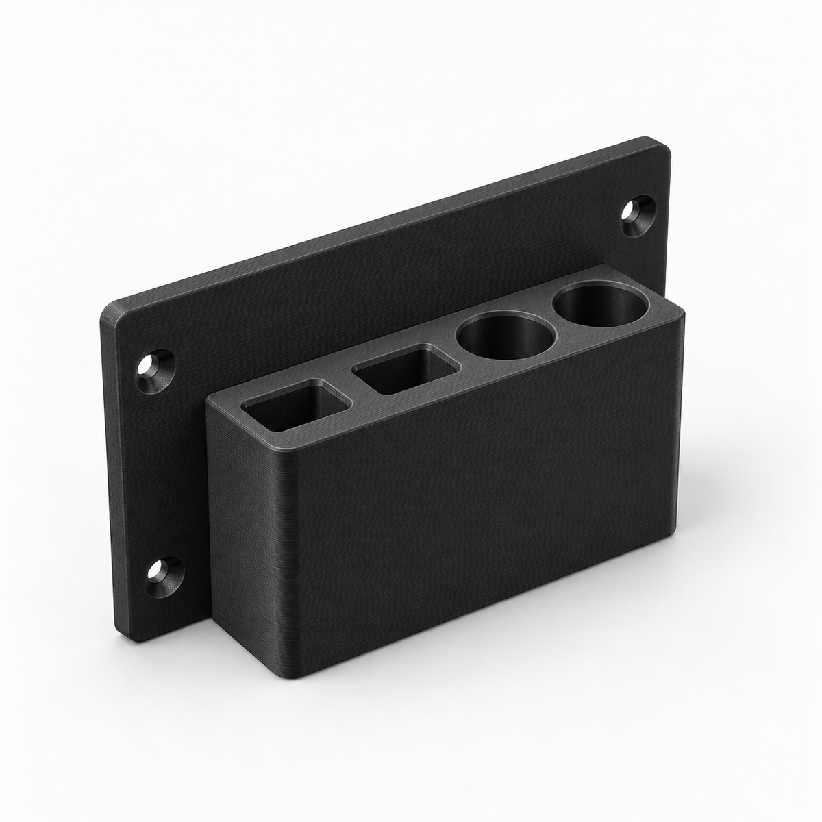 The black four-pocket pencil and marker holder on its own, showing two rectangular pencil slots, two round marker pockets and four countersunk screw holes.