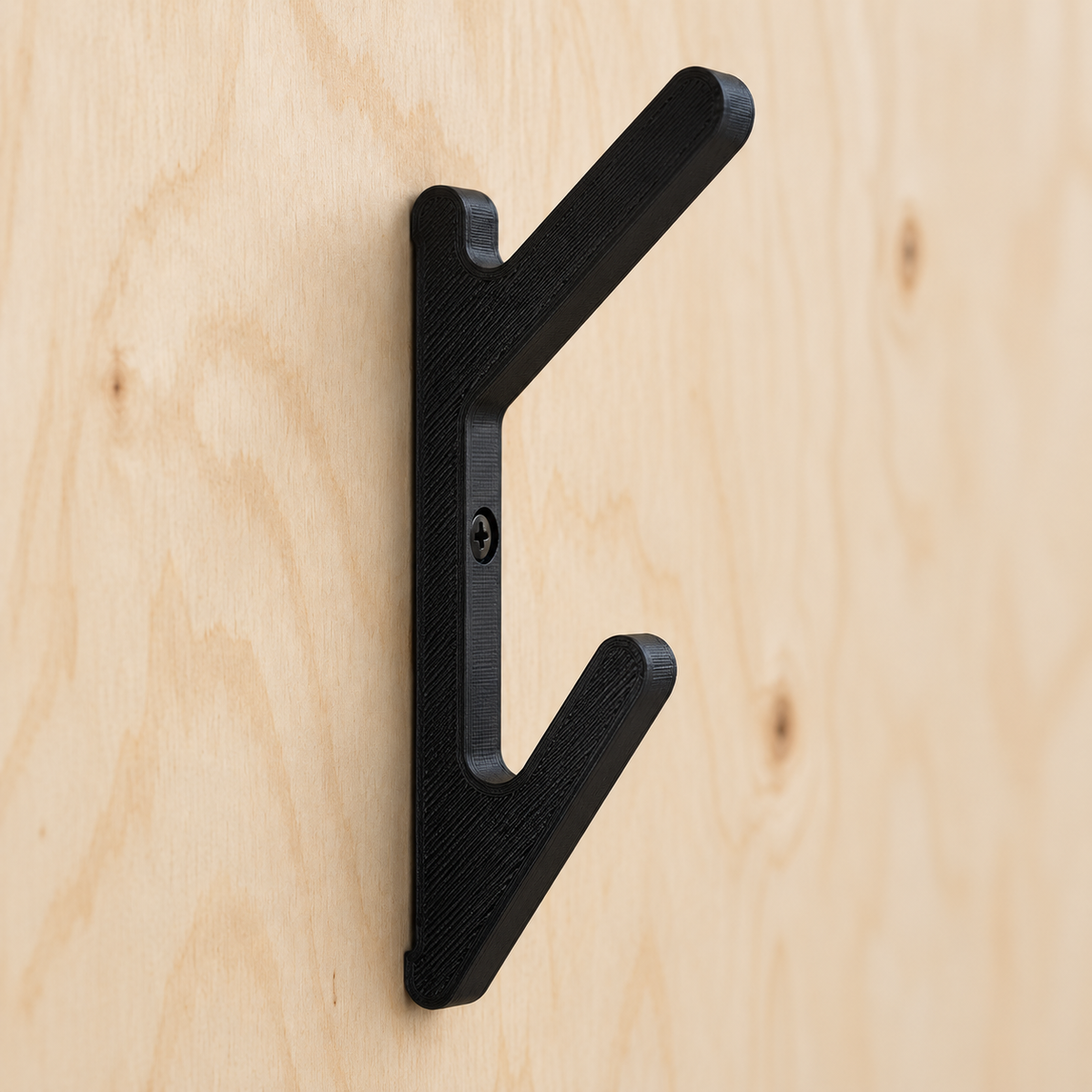 Installation example of one angled double hook screw-mounted to plywood.