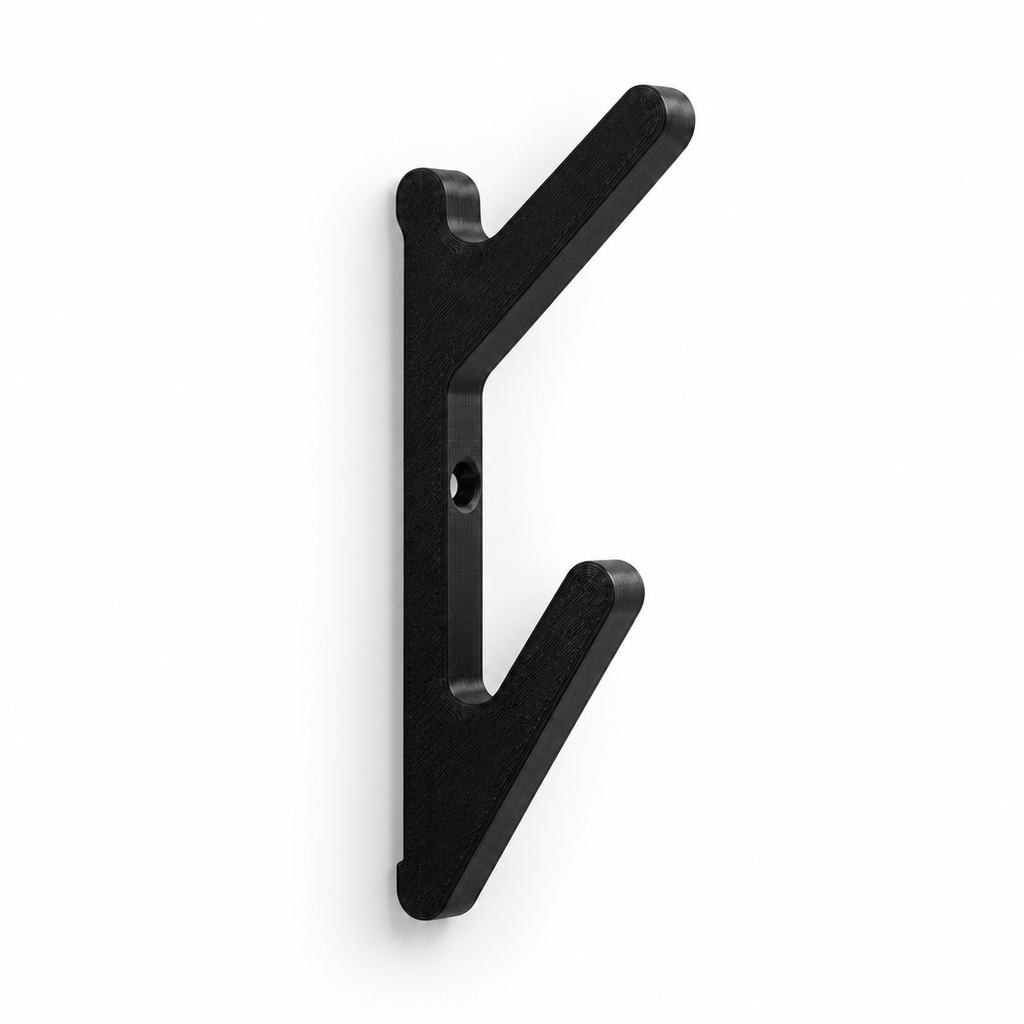 One black angled double hook showing two upward arms and its mounting hole; three units supplied.