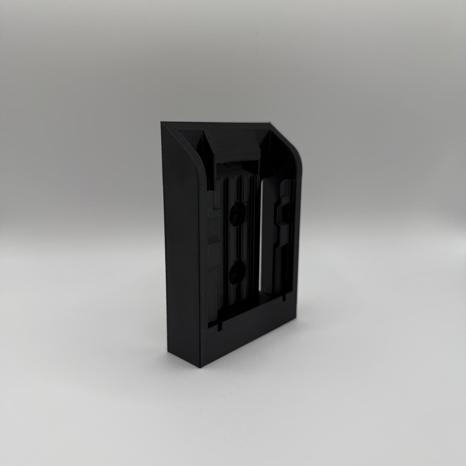 Black VanMount wall mount for DeWalt 18V XR batteries