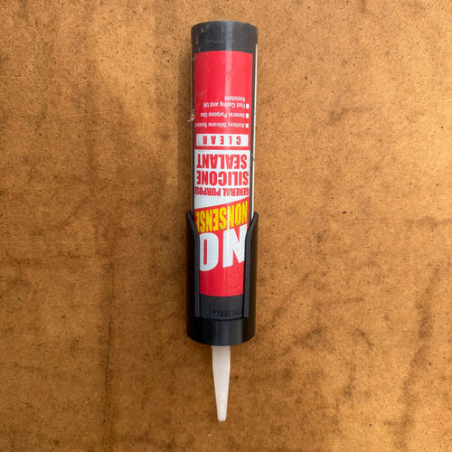 Sealant cartridge holder mounted to a board