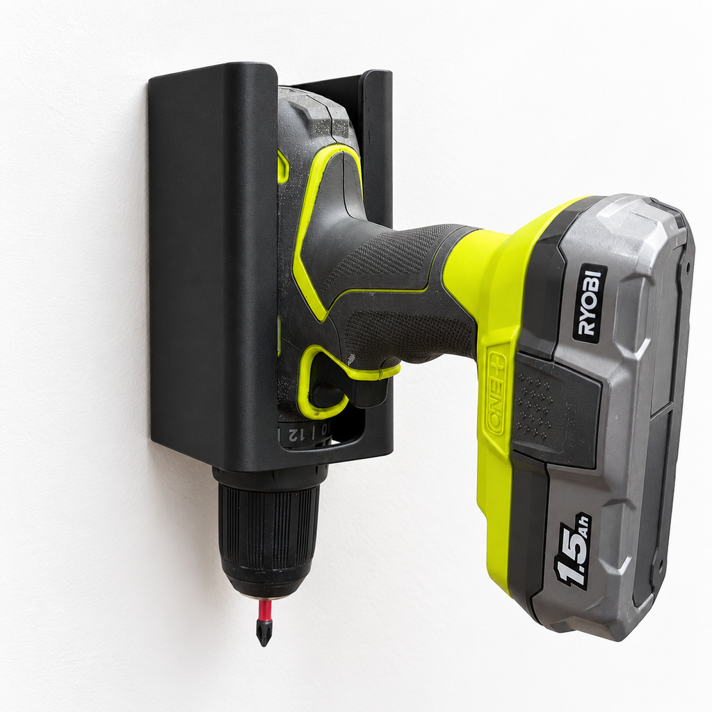 Cordless drill stored nose-down in a wall-mounted black drill holder.